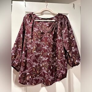 Burgundy floral blouse with slight v-neck. 3/4 length sleeve